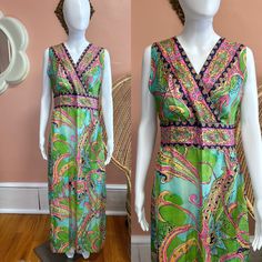 "Vibrant 70s handmade maxi dress. Dress has a colorful paisley/abstract print made up of pinks, blues and greens. The front is a criss cross top that cinches at the waist. Zips in back. Condition: Excellent/good - some light faded spots in dress but they do not detract from this beautiful dress! Measurements (approx.+ laid flat): Shoulder to shoulder:15.5\" Pit to pit:18\" Waist:16\" Hips:23\" Total length:54\" Follow us on IG for more shop updates @modern_m_vintage Check out our other listings: Green Lined Fitted Maxi Dress, Retro V-neck Dress With Vibrant Print, Fitted Bohemian Dresses With Floral Print, Fitted Lined Maxi Dress, Bohemian Fitted Spring Dresses, Bohemian Fitted Dresses For Spring, Fitted Bohemian Spring Dresses, Fitted Sleeveless Maxi Dress With Vibrant Print, Fitted V-neck Dress With Paisley Print