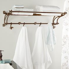 two towels hanging on a towel rack in a bathroom