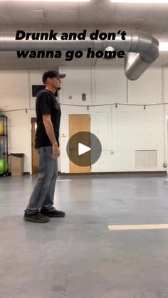 a man is standing in an empty garage