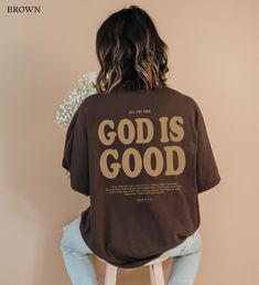 "Introducing our 'God Is Good Christian Crewneck Tshirt,' where the back boldly declares, \"ALL THE TIME GOD IS GOOD,\". Accompanied by the uplifting Psalm 34:1-10 - \"I will praise the Lord at all times; seek Him and be radiant, for those who fear the Lord lack nothing. Taste and see that the Lord is good; blessed is the one who takes refuge in Him.\". With subtle elegance, the front whispers the timeless truth - \"GOD IS GOOD.\" Embrace faith-based style and express your devotion with this Christian Shirt, a harmonious blend of Christian streetwear and scripture-inspired fashion. * Q U I C K * F A C T S * ✺ 100% preshrunk cotton ✺ Wash (inside out) and dry normally (on cool for best results) * S I Z I N G * ✺ Sizing is unisex so runs like men's, though not overly large ✺ Most women find Faith Based Tshirts, Fear The Lord, Christian Clothes, Faith Tshirts, Christian Crewneck, Time God, Christian Streetwear