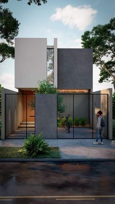 a person standing on the sidewalk in front of a house