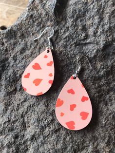 “RED HEARTS VALENTINE'S DAY TEARDROP DANGLE EARRINGS”Made out of up-cycled wood, with a sublimated with red hearts and pink background. These earrings are perfect for Valentine's Day, everyday wear, stocking stuffers, weddings, or a just because gift.Approximate Dimensions:1 1/2” X 1” (without drop)2 3/8" X 1" (with drop)Materials:Upcycled WoodHypoallergenic Stainless Steel Earring BackFacts:Sublimated DesignResourcefully Sourced MaterialsAssembled by Hand (by Me)Designed by MeMade in Spokane, W Clean Earrings, How To Clean Earrings, Earring Stand, Teardrop Dangle Earrings, Spokane Wa, Red Hearts, Stainless Steel Earrings, Computer Monitors, Just Because