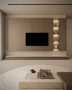 a living room with a large tv mounted on the wall above it's entertainment center