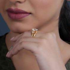 a close up of a person wearing a ring