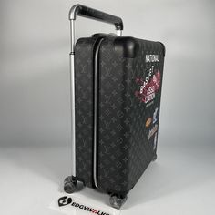 a piece of luggage with stickers on the side and handle is shown in front of a white background