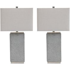 pair of grey stone lamps with white linen shades on each lamp and one light in the middle