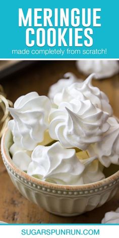 a bowl filled with meringue cookies on top of a wooden table and text overlay