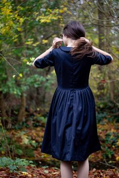 Navy wool pleated midi dress for women with Peter Pan collar great for winter in sizes XS - XXL ❃ The power of a beautiful dress is not to be underestimated. The right dress can transform your confidence and break hearts from across the room. Unlock that power with this simply beautiful 1950s dress. ❃ If you dare to think differently when it comes to dressing, this A line black dress will appeal. An intriguing mix of masculine tailoring and feminine flirtatiousness, it's the perfect way to showc Fall Midi Dress With Pleated Bodice, Fitted Classic Midi Dress For Fall, Fitted Pleated Winter Dress, Fall Midi-length Dresses With Pleated Bodice, Classic A-line Winter Dress, Fall Midi Length Dress With Pleated Bodice, Pleated Fitted Dresses For Winter, Fitted Pleated Dress For Winter, Pleated Midi Dress For Winter