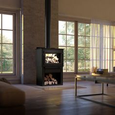 DROLET DECO ALTO WOOD STOVE - DB03220 A streamlined version of the traditional wood stove, the Deco Alto is ideal for spaces up to 2,100 ft². This large non-catalytic model releases up to 75,000 BTU/h and is certified according to the latest environmental standards. Its clean lines, higher-than-average height, and base with integrated storage space set the Deco Alto apart from other appliances on the market. Included: pedestal with log storage, rear air deflector, ash lip, ash drawer, air damper High Efficiency Wood Stove, Refractory Brick, Of Montreal, Vertical Design, Stove Fireplace, Wood Fireplace, Fireplace Inserts, Types Of Doors, Iron Doors