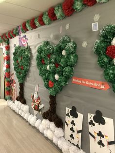 this is an image of a christmas themed classroom wall with paper pom poms