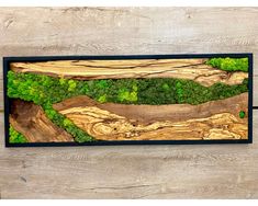 a wood panel with green trees on it