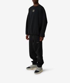 Founded in Germany in 1949, adidas is a renowned global brand known for its innovation, quality, and commitment to performance sportswear.Introducing the adidas Heavy Fleece Track Pants x Fear of God Athletics for Fall/Winter 2024. These negro sweatpants combine comfort and style seamlessly, perfect for your daily activities or lounging at home. Get yours now at SVD! Fear Of God Athletics, Innovative Streetwear, Adidas Crewneck, Global Icon, Streetwear Aesthetic, Black Sweatpants, Fall Winter 2024, Black Crewneck, Fear Of God