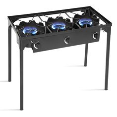 an outdoor stove with four burners on the front and back legs, in black metal frame