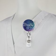 "Funny Nurse Badge Reel with \" Breathe\" in white with a little cardio heart, over a blue and purple watercolor background. ID Badge reels are ideal for Medical staff, Nurses, Doctors, Teachers, Students, Government and Transportation workers who are required to wear identification. I say...why not look stylish while wearing one! You can choose: SWIVEL CLIP Reels are the best choice for Doctors, Nurses and Hospital Staff! Clip attaches to any part of any garment and is great for connecting to a Customizable White Badge Holders For Personal Use, Adjustable White Badge Holder For Personal Use, Customizable White Badge Reel, Adjustable White Badge Holder As A Gift, Customizable Adjustable White Badge Holders, Adjustable Customizable White Badge Holders, Purple Watercolor Background, Stethoscope Id Tag, Id Lanyard