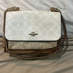 Coach Bag Parker Leather Crossbody Bag Brown Tan And Off White, Leather Used Please Review All The Photos. This Purse Is Absolutely Stunning And One Of The Kind Has Some Minor Wearing ( One Of My Fav Coach Purse I Wore It A Lot And Still Standing Strong) Has A Stain In Front. Interior Is Velvet Feeling Cream Color Can Be Crossbody Or Shoulder Bag Block Color With Monogram Letter “ C “ On It . Straps Is Chain And Leather Pocket In The Back White Travel Clutch Bag, White Clutch Bag For Travel, White Pouch Flap Bag For Travel, White Flap Bag For Travel With Dust Bag, Elegant White Flap Bag For Travel, White Flap Bag With Removable Pouch And Top Handle, White Top Handle Flap Bag With Removable Pouch, Cream Leather Bag With Chain Strap, White Tote Shoulder Bag With Chain Strap