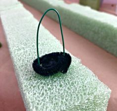 a small black object sitting on top of a table