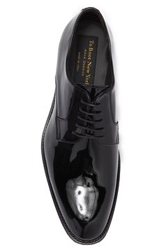 Shiny patent leather perfects this Derby style shoe with Italian crafting. 1/2" heel Lace up Plain toe Leather upper, lining and sole Made in Italy Goodyear Welted Patent Leather Dress Shoes With Almond Toe, Sleek Patent Leather Pointed Toe Oxfords, Evening Dress Shoes With Patent Leather And Rubber Sole, Evening Dress Shoes With Rubber Sole In Patent Leather, Patent Leather Pointed Toe Oxfords With Branded Insole, Goodyear Welted Patent Leather Cap Toe Dress Shoes, Sleek Patent Leather Oxfords With Rubber Sole, Sleek Patent Leather Dress Shoes With Almond Toe, Classic Patent Leather Dress Shoes For Party