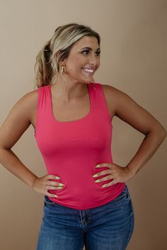 The Daily Bliss Basic Tank features a double-lined fabrication, square neckline, and generous stretch fabrication. The ideal basic to style effortlessly throughout the season. Neckline: Square Fabric: 95% Rayon, 5% Spandex Double lined fabrication Square neckline Generous stretch Imported Fit: True to size!- Chest: Fitted; Generous stretch- Designed to have a an ultra slimming fitted style met with generous stretch fabrication Model Specs: Emily is wearing a size small in the photo.How will this Casual Pink Square Neck Tank Top, Fitted Pink Square Neck Tank Top, Style Wide Leg Jeans, Bride Top, Square Fabric, Everyday Chic, Exclusive Dress, Fitted Style, Curvy Dress