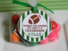 a bag filled with candy covered in green and white stripes