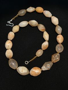 A beautiful string of Bended white agate natural found from Afghanistan dating 1800 yrs. They are found at that time in Afghanistan mostly but also some found in India and Pakistan too. They were used as a special charm jewellery by the affluents at that time period. Beautiful counter bronze are decorated further in between the beads. Spiritual Round Chalcedony Bead Jewelry, Spiritual Tumbled Agate Jewelry, Rondelle Agate Jewelry With Natural Stones, Agate Rondelle Natural Stone Jewelry, Oval Agate Bead Gemstone Jewelry, Oval Agate Bead Jewelry With Gemstones, Traditional Agate Beaded Jewelry, Traditional Agate Gemstone Beads Jewelry, Oval Agate Gemstone Bead Necklaces