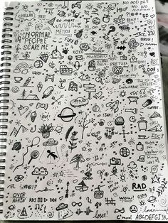 an open notebook with doodles on it