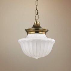 a light fixture hanging from a ceiling with a chain attached to the bottom of it