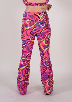 Be the raddest kitty at the festival in our most requested pants, the Groovy Bellbottoms! Made for booty-shaking, featuring a wide slimming waistband. Perfect flare while hugging every curve. Product Details 4-way stretch spandex blend Wide self stretch waistband Handmade in Brooklyn All items are made to order. Need a customization? Reach out to us HERE so we can provide you the perfect fit. Trendy High Waist Pants For Festival, Trendy High Waist Bottoms For Festivals, Fitted Wide Leg Festival Bottoms, Fitted Wide Leg Bottoms For Festival, Fitted Wide-leg Bottoms For Festival, High-waisted Pants For Festival, High Waist Fitted Bottoms For Festival, Multicolor Stretch High-waisted Pants, Trendy Stretch Pants For Festivals