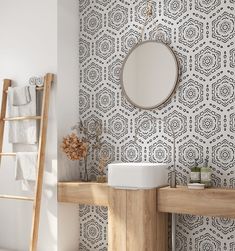 a bathroom with a wooden ladder and wallpaper in the background, along with a round mirror on the wall