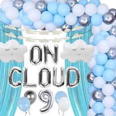 balloons and streamers with the words on cloud 9