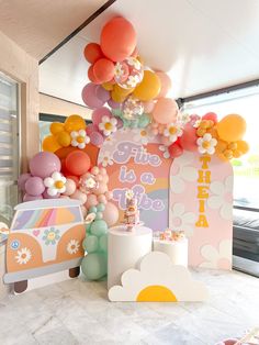 an assortment of balloons and decorations for a birthday party