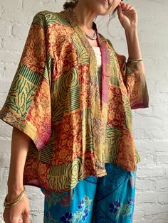 "Beautiful and light silk topper suitable for men and ladies  Made in one free size in up cycled silk MEAESURE Free size  Shoulder 18\" Bust up to 46\" Length 33\" MATERIAL *vintage silk  More boho style ideas at  https://www.etsy.com/shop/AltheaStores Thank you for looking" Bohemian Printed Open Front Tops, Bohemian Open Front Printed Tops, Vintage Open Front Kimono For Summer, Vintage Open Front Summer Kimono, Vintage Silk Kimono For Summer, Long Sleeve Kimono With Natural Dye And Relaxed Fit, Summer Vintage Silk Kimono, Bohemian Oversized Blouse With Batwing Sleeves, Bohemian Batwing Sleeve Blouse For Summer