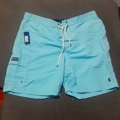 This Item Is In Wonderful Condition. Light Blue Beachwear Shorts, Light Blue Short Swimwear For Beach, Short Light Blue Swimwear For The Beach, Fitted Blue Shorts For Pool, Blue Fitted Shorts For Pool, Blue Tight-fitting Shorts For The Pool, Blue Nylon Short Swim Trunks, Light Blue Beachwear Shorts For Beach Season, Blue Swim Bottoms With Pockets