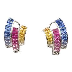 Rainbow Colour Sapphire 10.06 carats Earrings set in 18 Karat White Gold Settings Width: 1.6 cm Length: 2.5 cm Total Weight: 14.51 grams "We first opened doors in 1980 when it was then situated in the vicinity of the Victory Monument; a small and modest storefront with a couple of counters. From its humble beginnings to where it stands today, our company has proven its abilities as a jeweler. Since the beginning, we have been supplying fine quality pieces to dealers, wholesalers and customers wo Luxury Multi-stone Diamond Earrings For Anniversary, Multi-stone White Gold Earrings For Formal Occasions, Luxury Multi-stone White Gold Earrings, Luxury White Gold Multi-stone Earrings, Luxury Multicolor Diamond Earrings, Formal Multi-stone Fine Jewelry Earrings, Multicolor Diamond Round Earrings, Multicolor Round Diamond Earrings, Formal Multicolor Gemstone Earrings