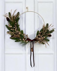 a wreath is hanging on the front door