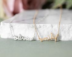 ♥ Dainty name necklace is the most unique personalized necklace you can ever find. ∙ ∙ ∙ ∙ ∙ ∙ ∙ ∙ ∙ ∙ D E T A I L S ∙ ∙ ∙ ∙ ∙ ∙ ∙ ∙ ∙ ∙ * Material: High Quality Solid Sterling Silver 925 (safe for sensitive skin). * Charm Size: 1.5 - 2.5cm (depends on name length and font style) * Model wear 17 inches * Finish: Sterling Silver ∙ Yellow Gold Plated ∙ Rose Gold Plated * Handcrafted with Love and Care ♥ Our 18k gold plated jewelry is much thicker than other gold plating, resulting in a durable, lo Custom Text Silver Jewelry For Wedding, Custom Wedding Nameplate Necklace, Custom Silver Name Necklace For Wedding, Custom Silver Necklace With Name For Wedding, Custom Sterling Silver Name Necklace For Wedding, Personalized Nameplate Necklace For Wedding Gift, Silver Nameplate Necklace For Wedding Gift, White Name Jewelry For Wedding, Customizable Nameplate Necklace For Wedding Gift