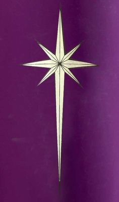 a white paper star on a purple background