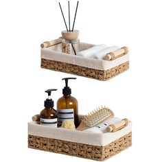 two wicker baskets with soaps, lotion bottles and other bathroom items on them