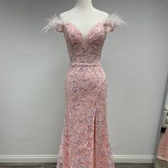 Radiate Beauty And Captivate Hearts With Our Irresistible Blush Sequin And Lace Mermaid Gown. This Enchanting Gown Is Designed To Make You Feel Like A True Princess, With Its Long Length, Alluring Illusion Deep V-Neckline, Figure-Hugging Mermaid Silhouette, And Exquisite Sequin, Lace, And Feather Embellishments. Prepare To Leave A Lasting Impression With This Glamorous And Romantic Masterpiece. Length: Long Color: Blush Neckline: Illusion Deep V-Neck Silhouette: Mermaid Sleeve: Off Shoulder Back Windsor Dresses Prom, Asymmetrical Prom Dress, Womens Evening Gowns, Orange Prom Dresses, Long Mermaid Dress, Tea Length Bridesmaid Dresses, Beaded Prom Dress, Satin Prom Dress, Plus Size Prom Dresses