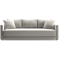 a white couch with two pillows on the back and one arm folded out to show it's side