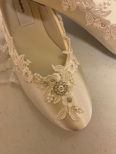 Victorian style Flat Shoes Gorgeous flat shoes decorated with fine white American lace Pearls & Glass Crystals Retro Victorian - Modern look, I'm very pleased with my new design! I only have so many yards, order as soon as you fall in love with them ;0 These flats are satin, with man-made insoles, and sueded leather outer soles. (Please Note: These are NOT Professional Ballerina Slippers. They are Bridal Ballet Style Flats.) Not for Wet areas/grass. Colors: Eggplant/Ivory Eggplant/white, Whi Elegant Wedding Shoes With Laces, Elegant Closed Toe Flats For Ceremony, Elegant Wedding Shoes With Lace Trim, Elegant Almond Toe Ballet Flats For Wedding, Elegant Round Toe Ballet Flats For Wedding, Elegant Wedding Ballet Flats With Round Toe, Elegant Ballet Flats For Wedding, Pearl Embellished Wedding Flats, Elegant Closed Toe Wedding Shoes With Laces