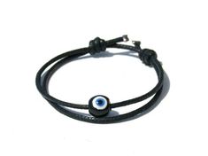 Evil eye bracelet, Evil eye string bracelet,Mens protection bracelet-Mens evil eye bracelet-Men bracelet This bracelet is made of round evil eye bead or cubic blue bead with adjustable coton cord. Round evil eye bead is handmade ceramic. Cubic evil eye bead is handmade glass. The evil eye bead gives protection and brings luck to all. It will help to protect you and bring you good fortune. It is designed to wear everyday and great as a gift for a women or a man. This evil eye bracelet is adjustab Evil Eye Bracelet For Men, Evil Eye String Bracelet, Round Evil Eye, Bracelet Evil Eye, Red String, Bracelet Mens, Protection Bracelet, Eye Bracelet, Bracelet For Men