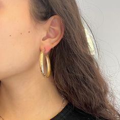 Gold hoops belong in everyone’s jewelry suite - perfect for daily wear in a bold, gold way! They’ve got a texture to them that is absolutely delightful, in addition to the unique two-tone gold going on! Also, big fans of the size on these bad boys. 14kt yellow & white gold 7.4 grams Measures 1.75" in diameter x 4.8mm wide x 2.0mm thick Elegant Hammered Gold Plated Hoop Earrings, Hammered Hoop Jewelry, Hammered Hoop Earrings For Anniversary, Elegant Small Hoop Hammered Earrings, Elegant Hammered Hoop Earrings For Anniversary, Elegant Small Hammered Hoop Earrings, Hammered Yellow Gold Hoop Earrings, Gold Hoop Earrings With Shiny Finish, Fine Jewelry, Gold Hoop Earrings With Shiny Finish