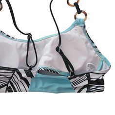 Embrace beachside elegance with our Sky Blue Printed Three-piece Sporty Bikini Set by Rita Rosa Brazilian Beachwear. This chic ensemble features a customizable sporty top and a flattering, moderate bottom. Keep the removable pads in for extra shaping during beach volleyball or take them out for a natural sunbathing look. Crafted sustainably with love, this bikini adds a unique touch to your beachwear collection. 🌊👙 Shop now at Rita Rosa Brazilian Beachwear. 🛒✨ Imported worldwide 🌍 Blue Stretch Swimwear With Built-in Cups, Fitted Swimwear With Padded Cups For Vacation, Tropical Style Tankini With Adjustable Straps For Beach Season, Beach Season Tankini With Padded Cups, Beachwear Tankini With Built-in Cups For Swimming, Sleeveless Vacation Swimwear With Built-in Cups, Sports Halter Neck Tankini For Beachwear, Sleeveless Tankini With Built-in Cups For Beach, Sports Halter Neck Swimwear With Adjustable Straps