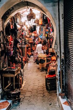 an alley way with lots of items on display