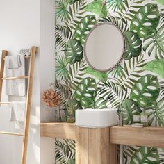 the bathroom is decorated with tropical wallpaper and a round mirror above the sink, along with a ladder to the right