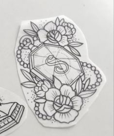 two stickers with flowers on them and a cake in the middle one has a diamond