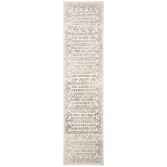 a white runner rug with an intricate design