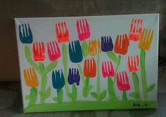 an art project made with children's handprints of colorful flowers and forks