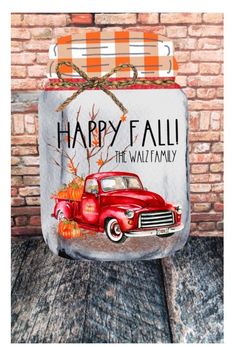 a mason jar with an old red truck painted on it and the words happy fall