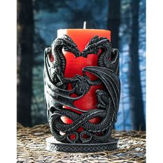 a dragon candle holder sitting on top of a table